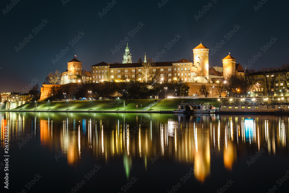 The Royal Wawel Castle as seen from another bank of Vistula. Krakow is the most famous landmark in Poland. Night view