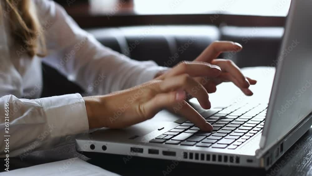 Female lawyer typing on laptop, checking data in agreement, sending e-mail Female lawyer typing on laptop, checking data in agreement, sending e-mail