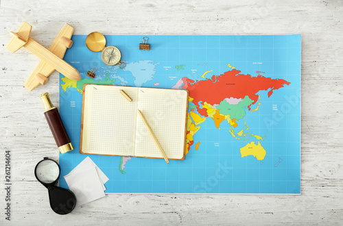 World map with notebook and...