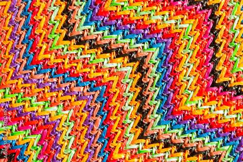 Abstract textured zigzag background of close up detail in woven raffia