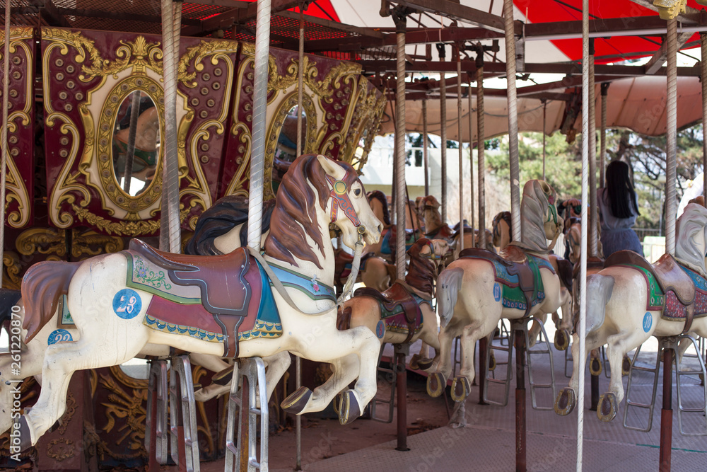 merry-go-round wooden horses. ride a carousel