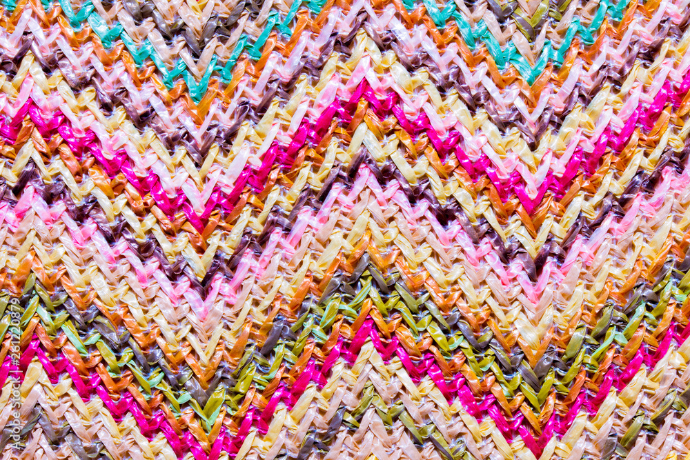 Abstract textured zigzag background of close up detail in woven raffia