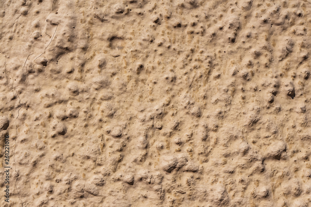 A beautiful horizontal texture of part of an old wall with yellow and orange plaster on the photo A beautiful horizontal texture of part of an old wall with yellow and orange plaster on the photo
