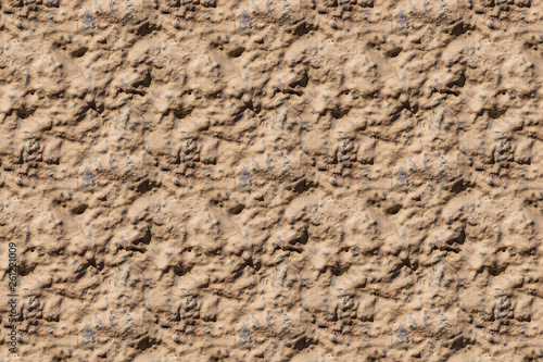 A beautiful horizontal texture of part of an old wall with yellow and orange plaster on the photo. Seamless pattern texture