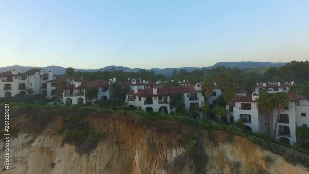 Aerial drone flying up rocky cliff Aerial drone flying up rocky cliff