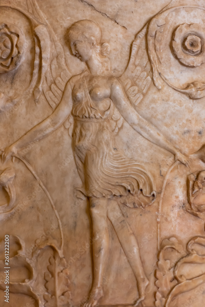 Female angel carved on marble
