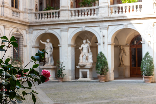 Classical statues in an old building courtyard in Rome