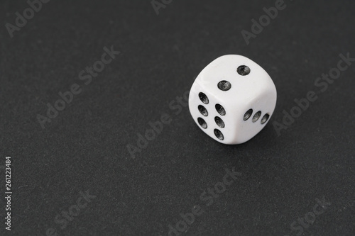 a dice over black surface