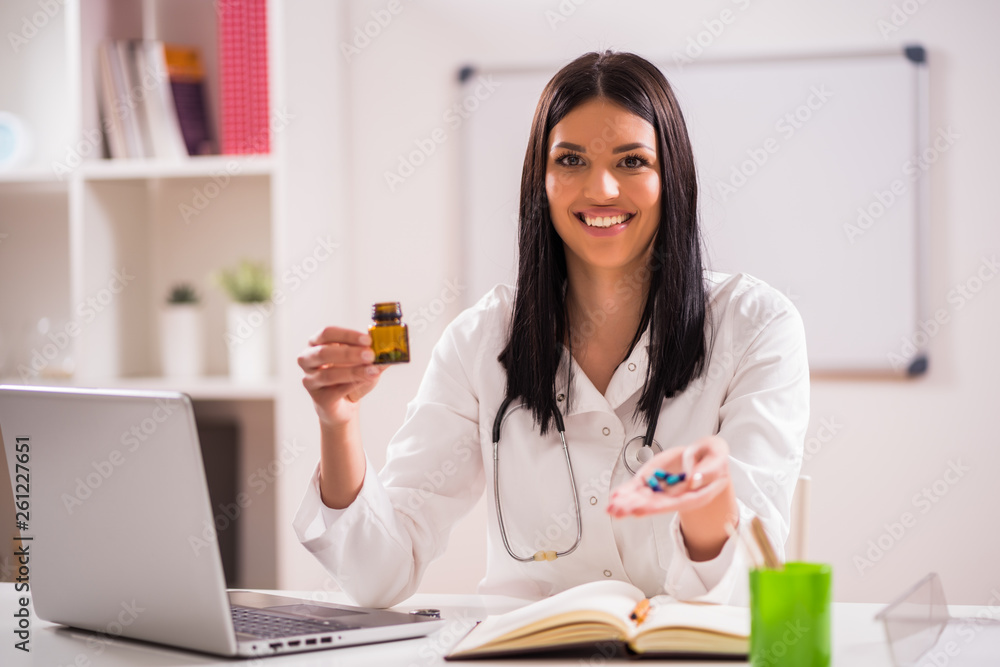 Young doctor is talking about taking pills. Young doctor is talking about taking pills.