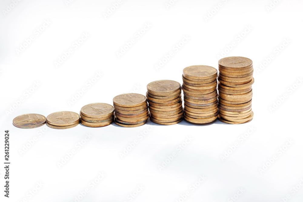 The concept of saving money set up on a white background. The concept of saving money set up on a white background.