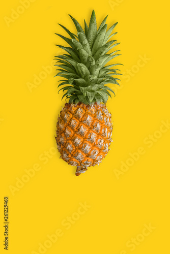 Ripe pineapple at the yellow background. Healthy dietary food.