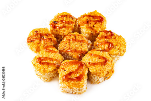 Closeup hot sushi rolls set with fried cheese, sesame and teriyaki isolated at white background.