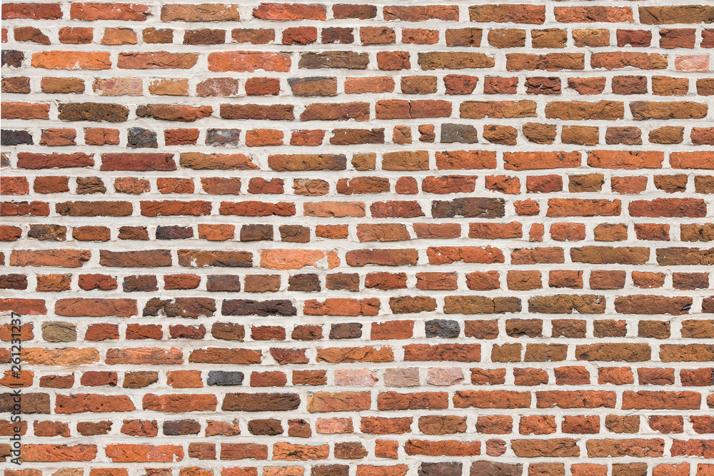 Full-frame red old brick wall horizontal image with old colorful stones Full-frame red old brick wall horizontal image with old colorful stones