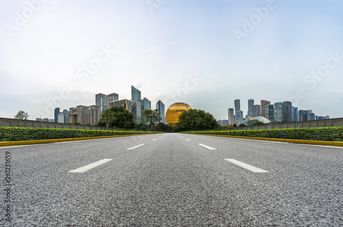 city road through modern buildings in hangzhou