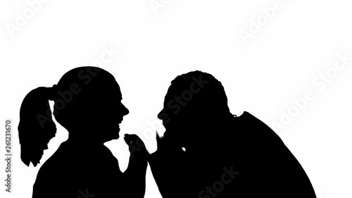 Female and male silhouettes swear on white background. Family scandal between husband and wife.