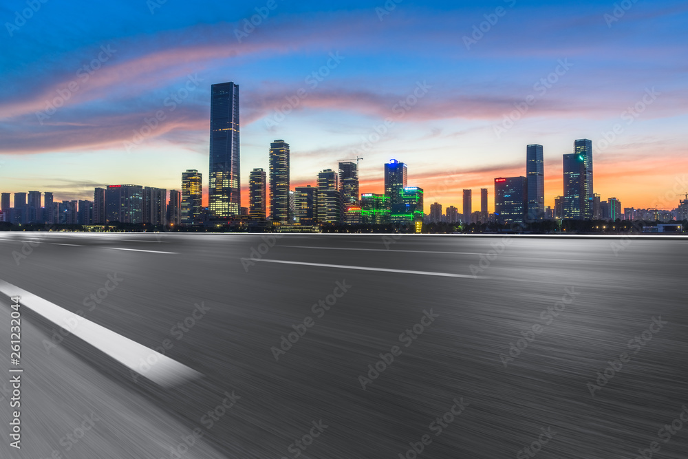 Empty urban road and modern skyline.