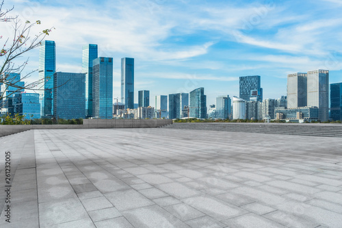 Panoramic skyline and buildings with empty square floor. © hallojulie