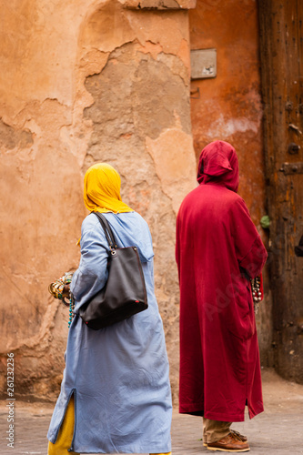 Peddlers trying to sell their products in the medina of Marrakesh, Morocco