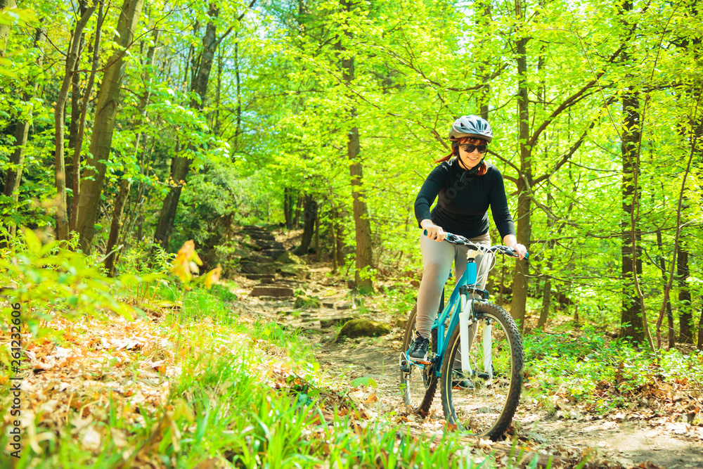 Naklejka premium Young Woman Riding Her Mountain Bike