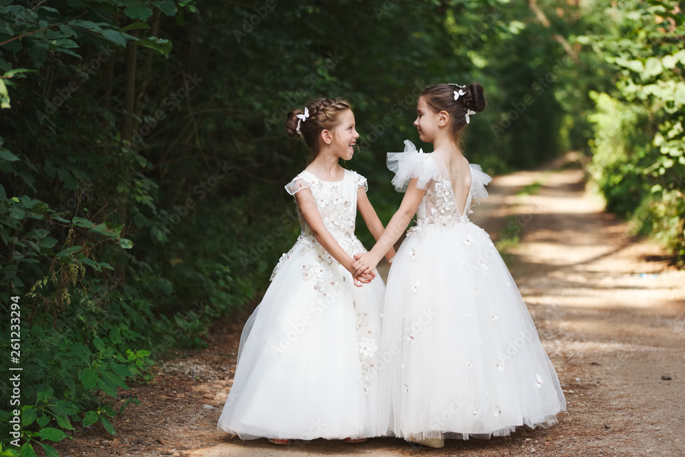 happy beautiful girls with white wedding dresses