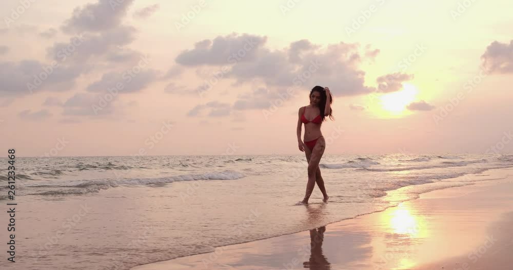 Bikini beach woman posing with sea background. Beautiful sexy mixed race woman with relaxing on summer travel vacation. Summer, Travel and Beauty concept. Bikini beach woman posing with sea background. Beautiful sexy mixed race woman with relaxing on summer travel vacation. Summer, Travel and Beauty concept.