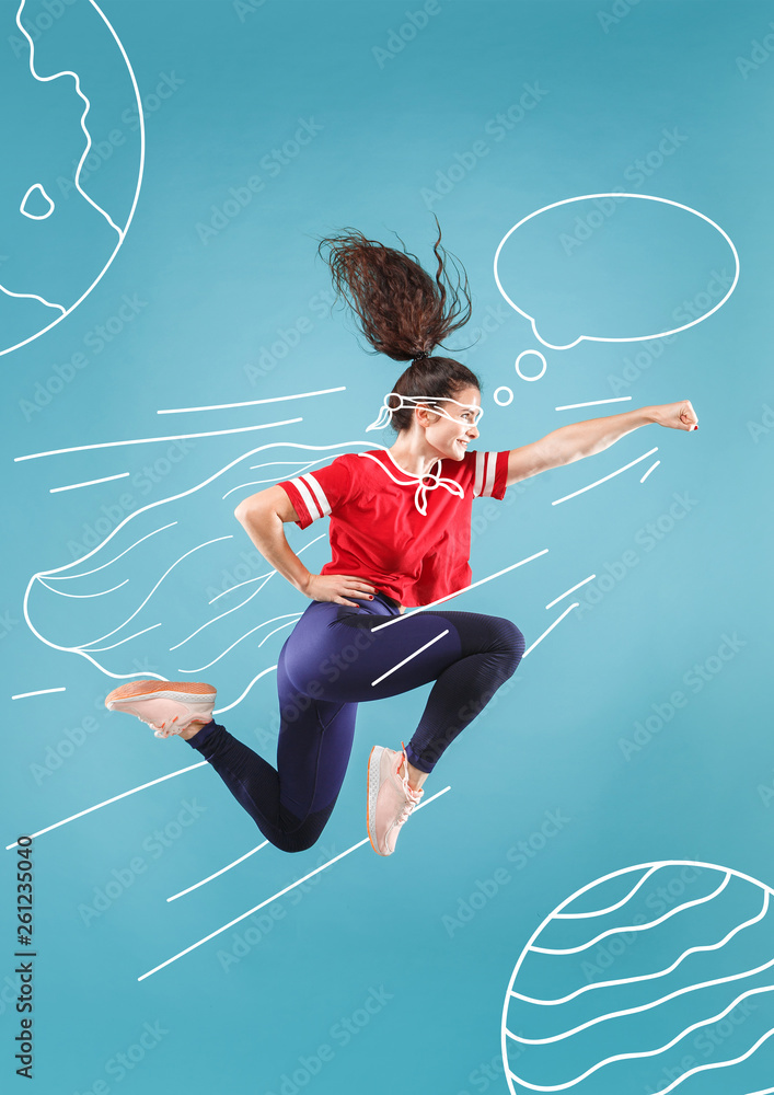 Hurry up to save the universe. Dreaming about cosmonaut profession or travel the cosmos. Young woman in drawing imaginary spacesuit against blue background. Concept of childhood and dreams. - obrazy, fototapety, plakaty 