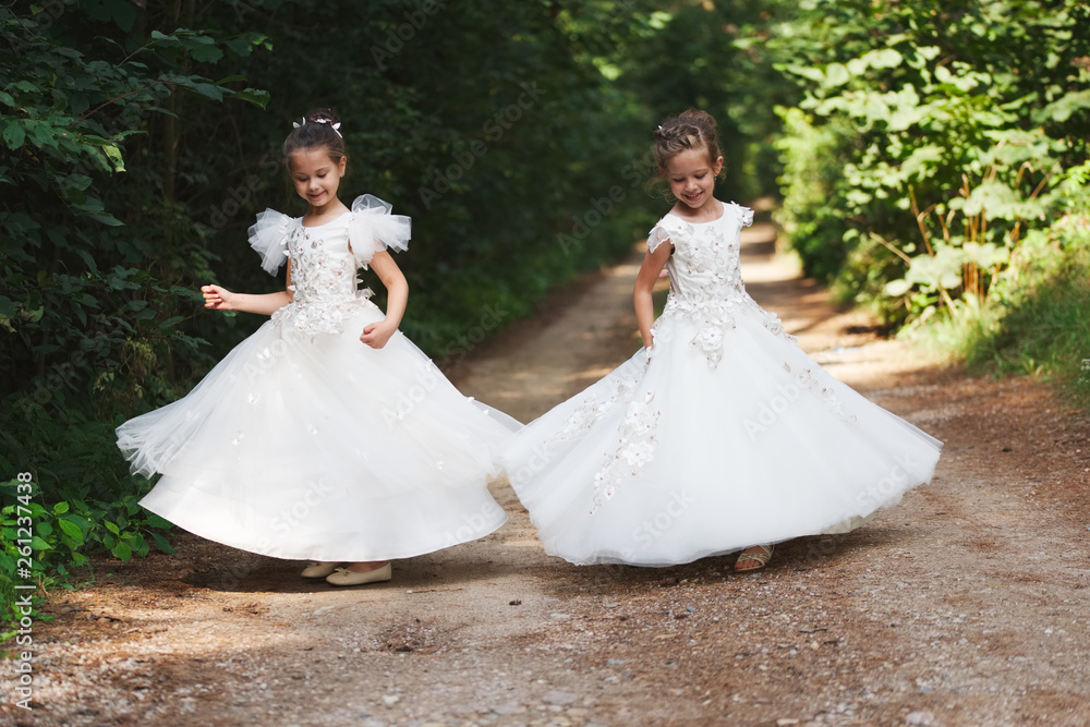 Fototapeta premium happy beautiful girls with white wedding dresses