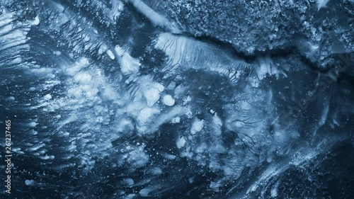 Close-up of melting ice on black background