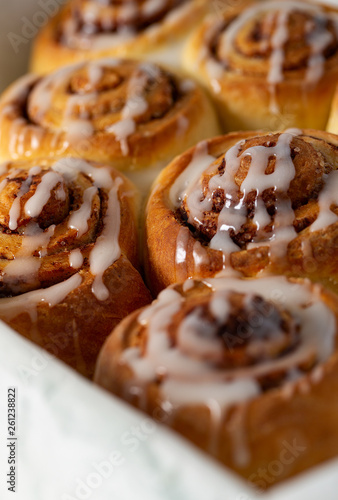 cinnamon rolls on wooden surface