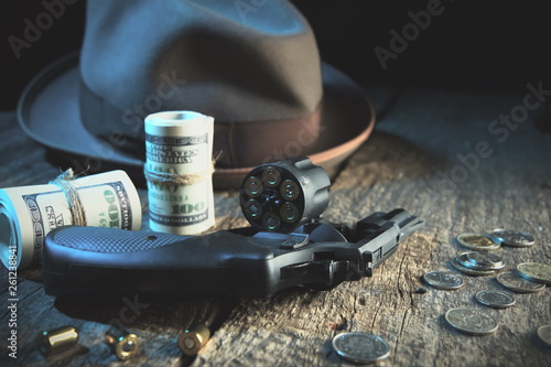 Guns and money.Gangster coat,bullet,dollars .The concept of crime.Smoky background.Retro and vintage style.