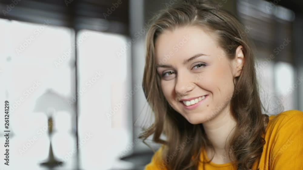 Smiling woman with cup of coffee looking at camera, restaurant service review Smiling woman with cup of coffee looking at camera, restaurant service review