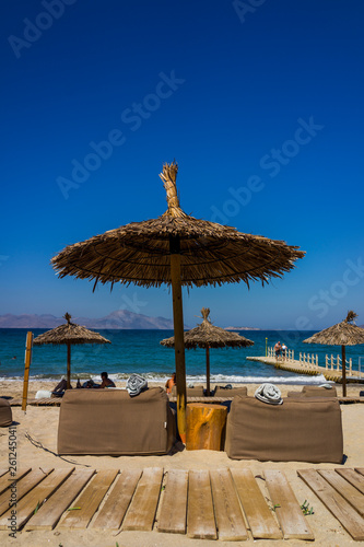 beach with chairs and umbrellas © sasha