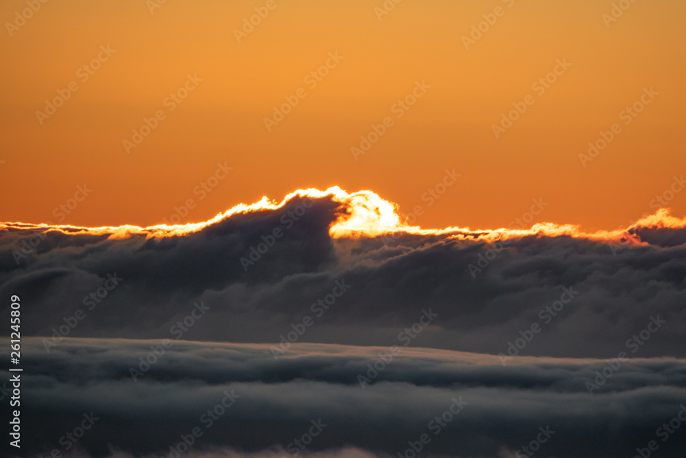 Cloud waves and sunset with orange space