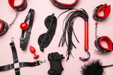 Set of erotic toys for BDSM. The game of sexual slavery with a whip, gag and leather blindfold. Intimate sex games.