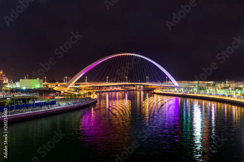 Light illuminated canal bridge and reflection of lights on river