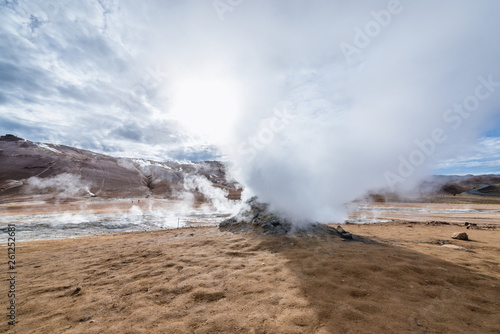 Steam in Hverir geothermal area with boiling mudpools and steaming fumaroles in Iceland