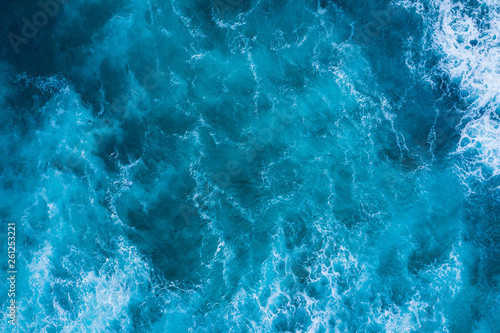 Fototapeta Top view of blue frothy sea surface