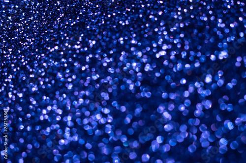 Blue glitter texture. Festive sparkling sequins background closeup. Wpaper for Valentine, New Year or Christmas Holidays