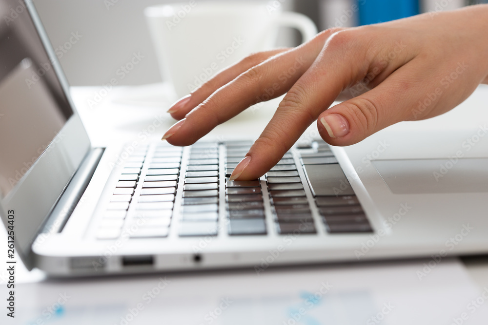 Close-up of hands of businesswoman typing on a laptop. Close-up of hands of businesswoman typing on a laptop.
