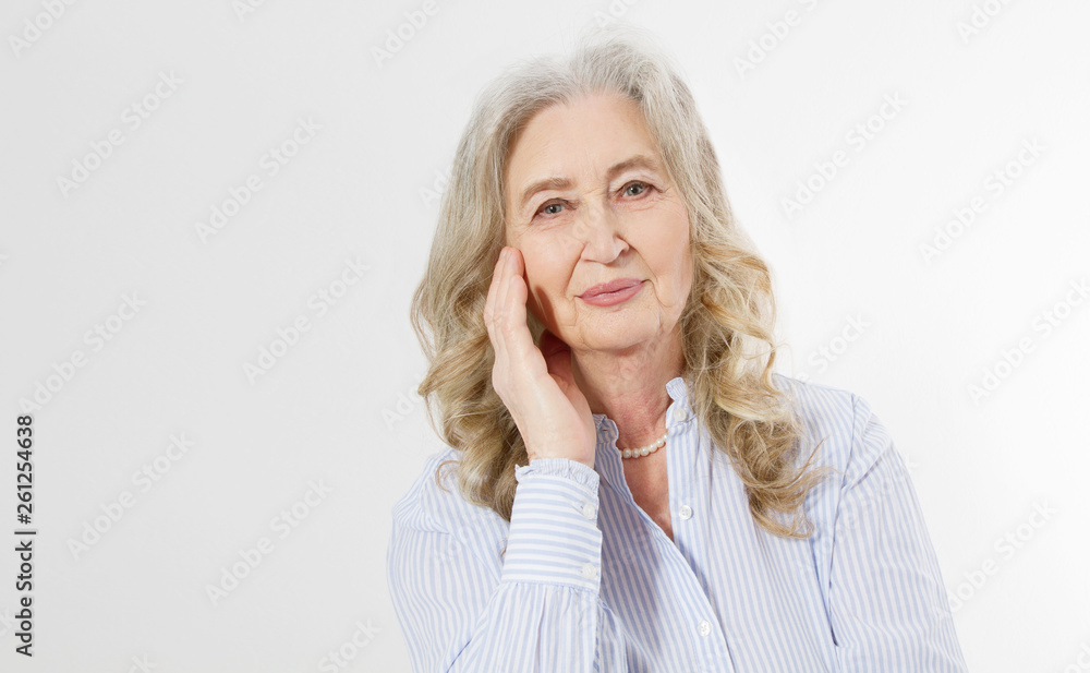 Closeup of smiling senior woman wrinkle face and gray hair. Old mature lady touching her wrinkled skin isolated on white background. Copy space Closeup of smiling senior woman wrinkle face and gray hair. Old mature lady touching her wrinkled skin isolated on white background. Copy space