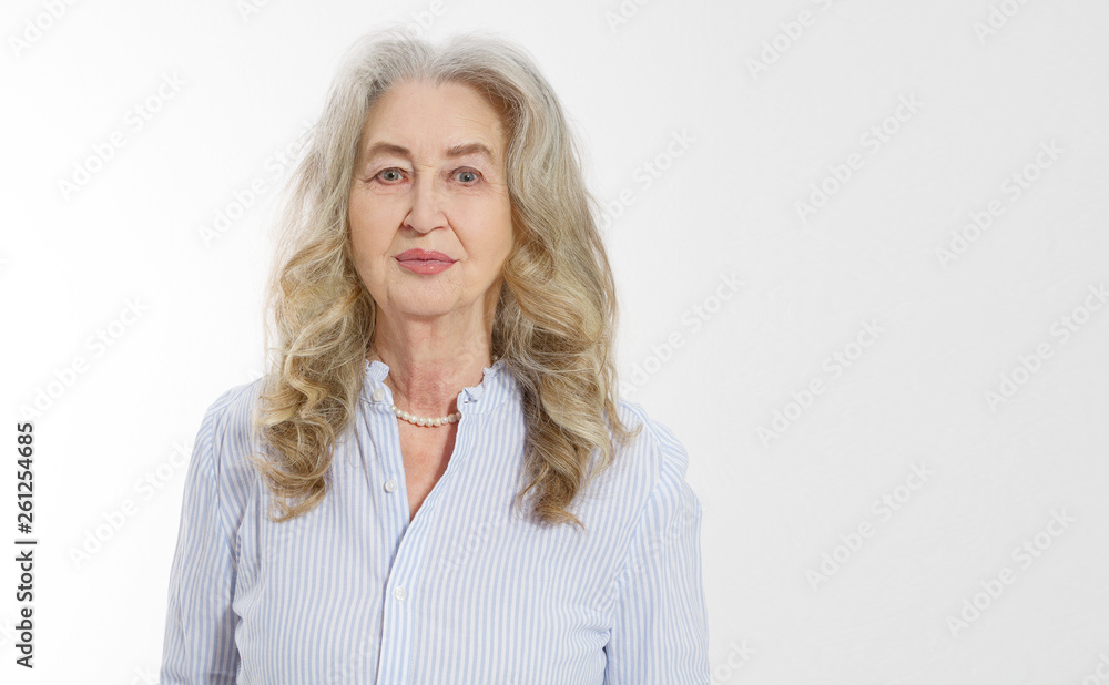 Close up of senior woman face isolated on white background. Happy old lady with wrinkled skin. Health care and wrinkles concept. Mature female. Copy space. Banner Close up of senior woman face isolated on white background. Happy old lady with wrinkled skin. Health care and wrinkles concept. Mature female. Copy space. Banner