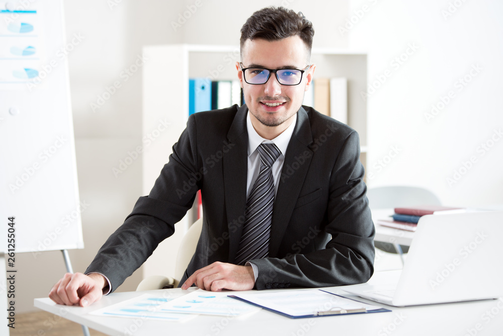 Portrait of businessman working in an office Portrait of businessman working in an office