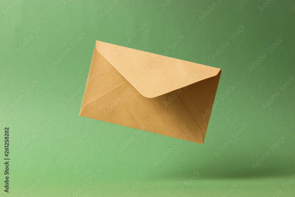 The envelope falls to the ground on a colored background. The envelope falls to the ground on a colored background.