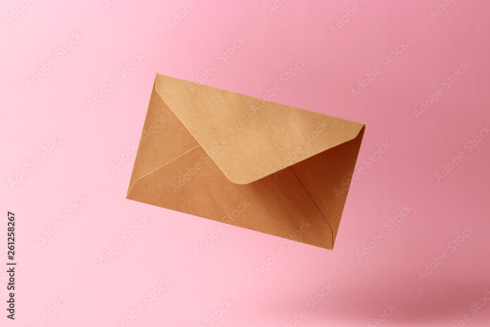The envelope falls to the ground on a colored background. The envelope falls to the ground on a colored background.