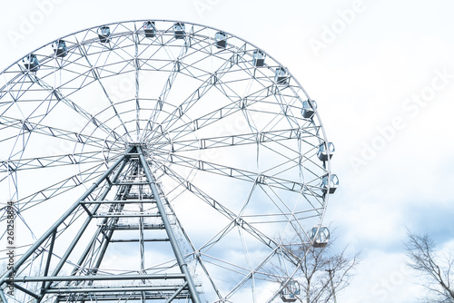 ferris or observation wheel over a blue sky