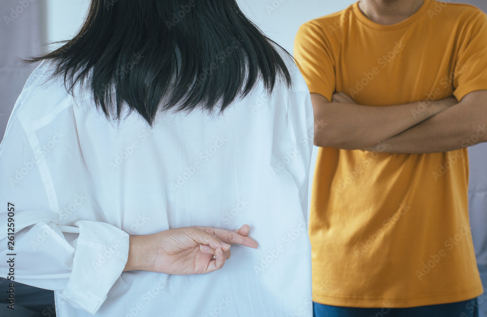 Lies women with hands crossing fingers behind back telling liar and cheating to husband Lies women with hands crossing fingers behind back telling liar and cheating to husband
