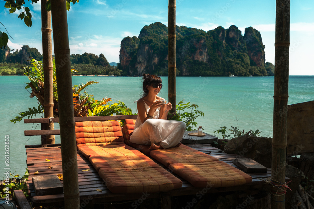 Beautiful girl resting on the sea. Lonely girl resting on the island. The girl on the Paradise coast. The girl on the Islands. A woman on a luxurious shore. Asian Islands. Holidays in Thailand