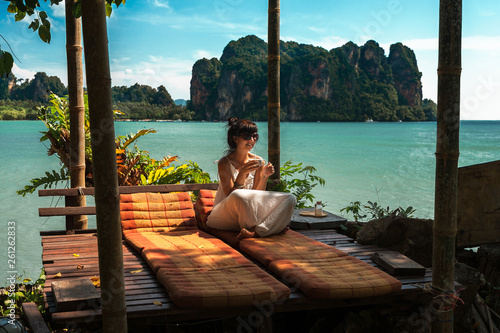 Beautiful girl resting on the sea. Lonely girl resting on the island. The girl on the Paradise coast. The girl on the Islands. A woman on a luxurious shore. Asian Islands. Holidays in Thailand © MISHA