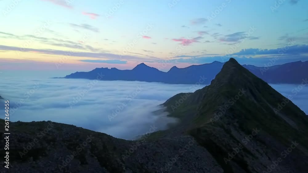 Aerial Pan: Thick Cloud Among Scenic Cliffs at Dusk in Senja Island, Norway Aerial Pan: Thick Cloud Among Scenic Cliffs at Dusk in Senja Island, Norway