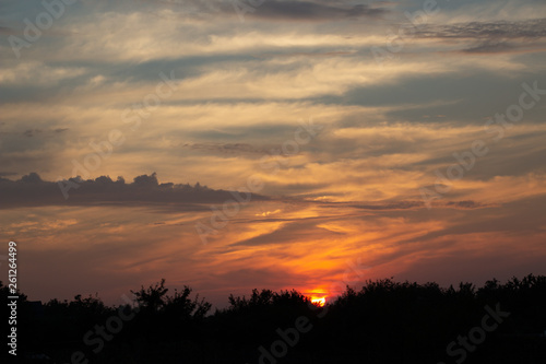 Beautiful sunset in the clouds, bright sun © Игорь Глущенко